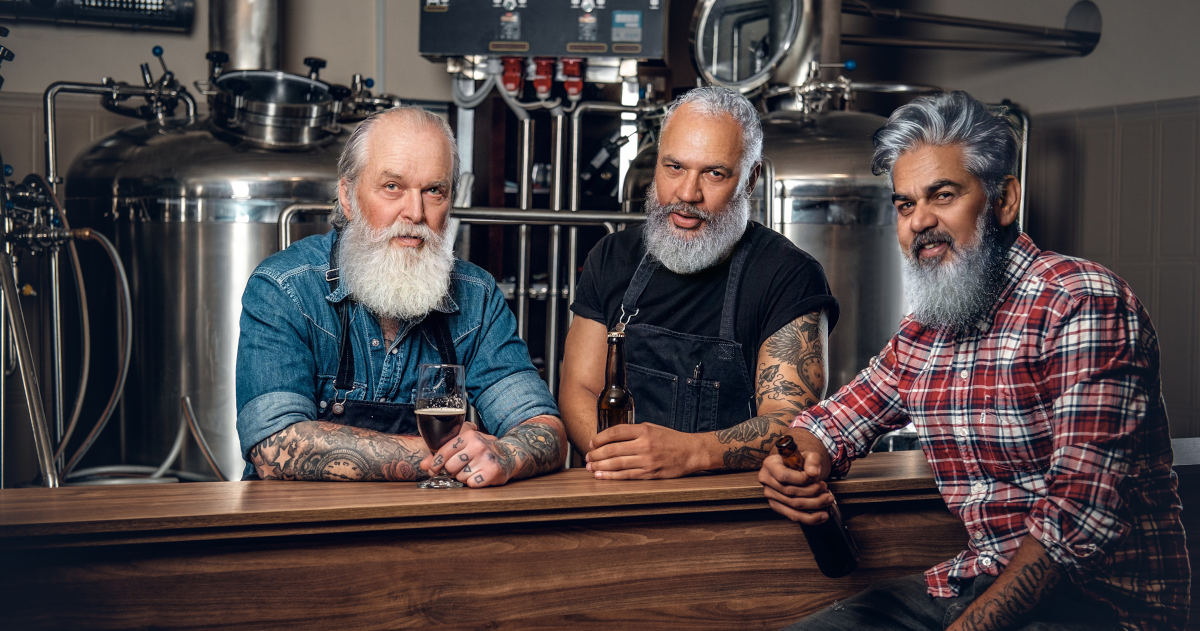 Three elderly brewery drinking beer in modern beer factory Craft Beer Sterotype